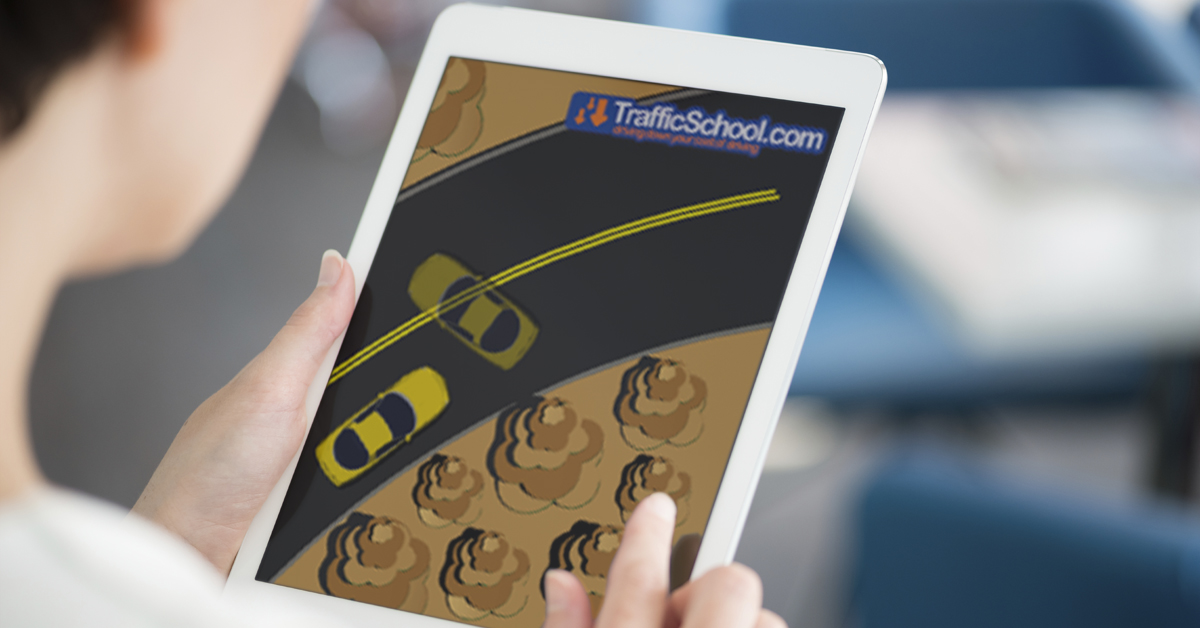 Woman completing traffic school on tablet